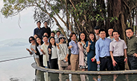 A group photo of executives from Fudan University at the Pavilion of Harmony of CUHK